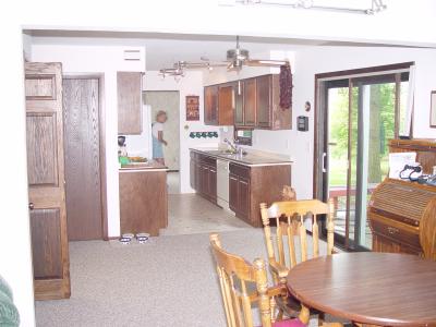 VIEW FROM FAMILY ROOM TO KITCHEN WITH WALL OUT