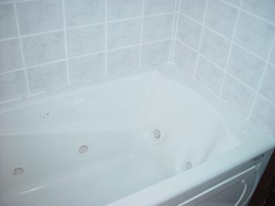 SARA'S NEW TUB WITH EIGHT JETS AND HEATER-NEW TILE WALLS