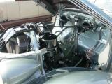 Engine compartment after.  Hood springs are cad (zinc plated)