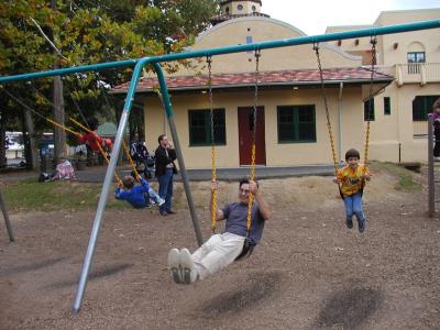 happy rich and adam on swings at glen echo