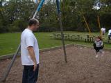 eddie and olivia on swing at glen echo park