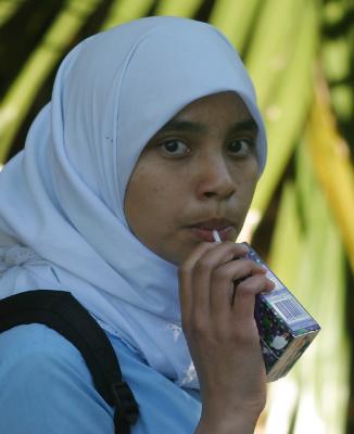 Islamic girl with straw