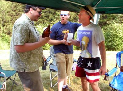 Ben Schwalb (far right) and a couple of CRABS members sample a homebrew