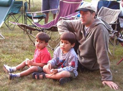 A dad and his kids listen to the music