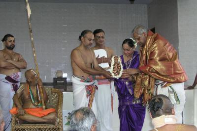 Smt. and Sri Badrinath being presented with a memento