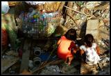 Kids playing in a garbage dump