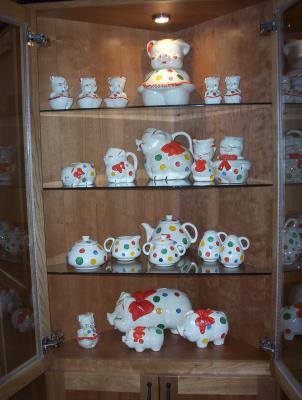One of my favorite collections. Vintage American Bisque Polka Dot Piggies, the matching tea set was a real find. They are so bright and cheerful, you can't help smiling when you look at them.