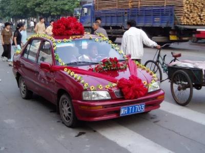 Taxi decorated as a wedding vehicle.