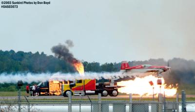 Aerobatic aircraft and Kent Shockley's Shockwave triple engine jet truck military aviation air show stock photo #6892