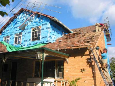 repairing a sagging corner of the old roof