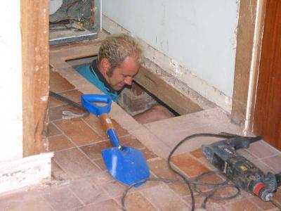 Brice digs a new stump hole by going through the floor