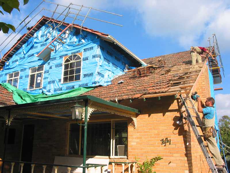 repairing a sagging corner of the old roof
