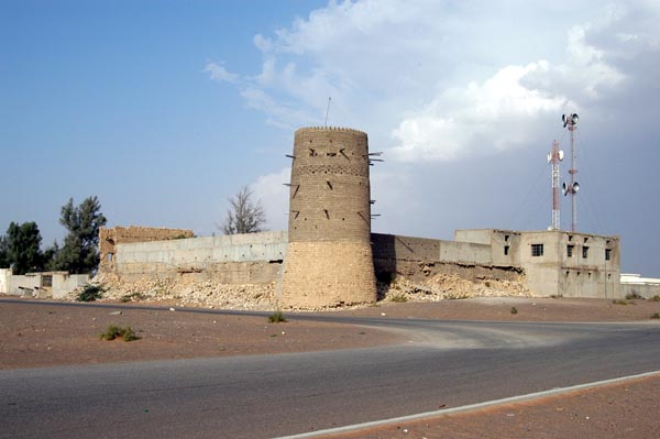 Remains of the central fort in Falaj al-Mualla with a storm rising in the background