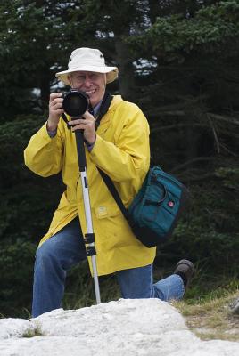 Upscale Gentleman takes photographs.