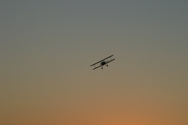 Flying Above the Setting Sun