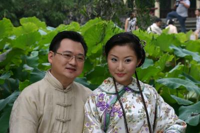 Chinese newlyweds posing for formal photographs.