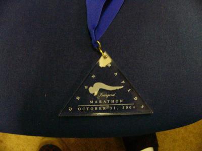 Finisher's medal - attractive laser-etched lucite triangle