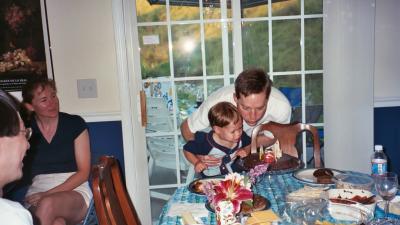 Ben and Papa blowing out the candle (John's 35th birthday in Durham, NC)