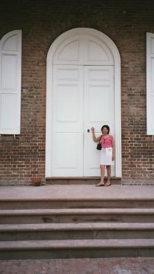 Tricia in front of the big door in Williamsburg, VA