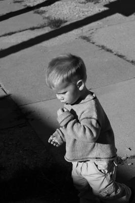 City Kid
Downtown-ish Colorado Springs, CO.  Just chasing the kids around with the camera.  My goal is to photograph them, their goal is to keep me from doing it, oh yeah, and to run out into the street, throw rocks, and eat bugs...  Such is life with three boys.