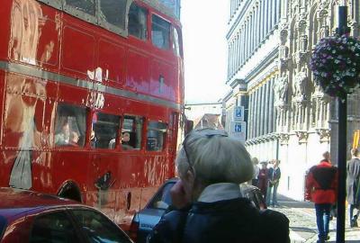 Red double deck bus near townhall, a wedding was on. Martha in front