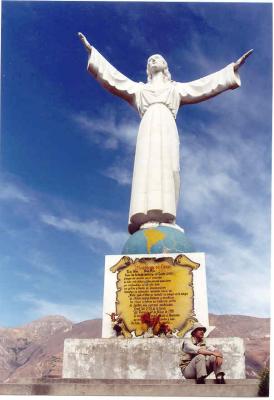 A huge statue of Christ on a knoll overlooking old Yungay faces the Huascaran