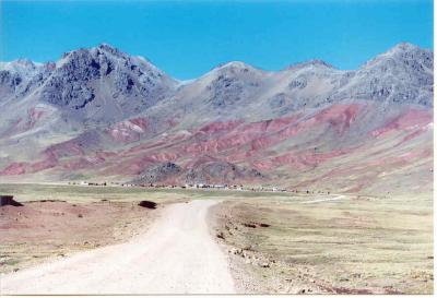 Landscapes in all possible pastel colours along one of the highest  drivable mountain roads of the world