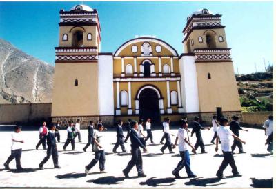 School parade in front of the church of Huaytar