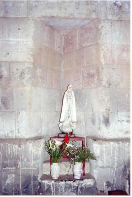 Another image of a saint in the triangular inca niches of Huaytar church