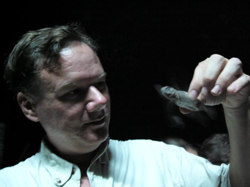 Peter holding a little hatchling
