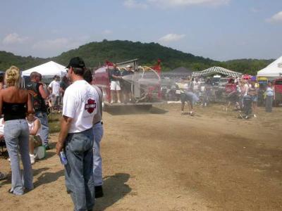 Spectators getting cooled by passing fire truck