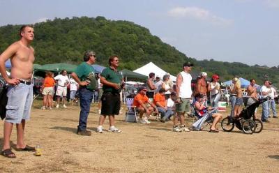 Standing spectators view the left course