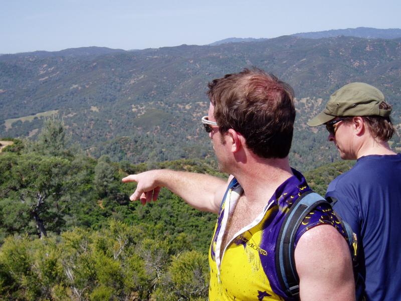Mustang Peak.  Tom pointing to hinterlands