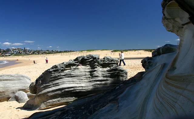 North Curl Curl beach showing sandstone cliffs