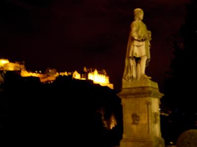 Edinburgh Castle, crowning the hill behind an unidentified statue.