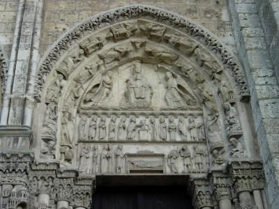 Carved tympanum on the west portal, depicting the Nativity.