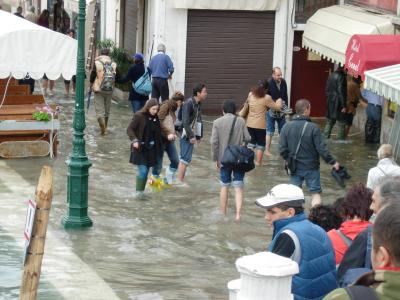 Day of the flood... tourists braved the waters in whatever they had.