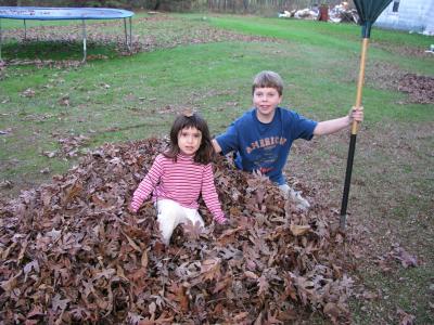 Nick and Sarah playing in the leaves