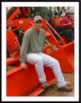 Me lusting after a Kubota tractor for which, of course, I would have no useful purpose. But it's great for manly posing.