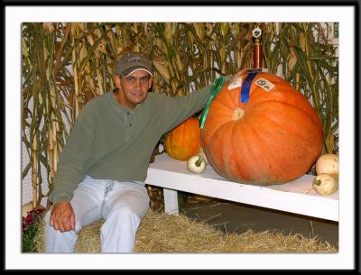 Me with my prize winning pumpkin. Okay, so it wasn't mine. But it could have been mine (in a different universe).