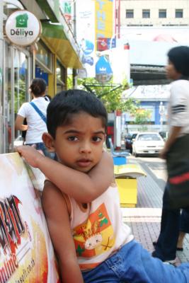 Seated on a Street in Mahboonkrong