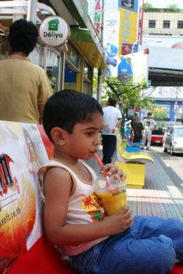 Seated on a Street in Mahboonkrong