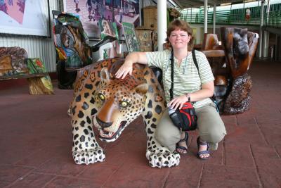 Angela with wood carving of a jaguar