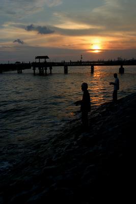 Fisherman And Sunset