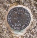 Benchmark disk in stone of Jones Falls Dam