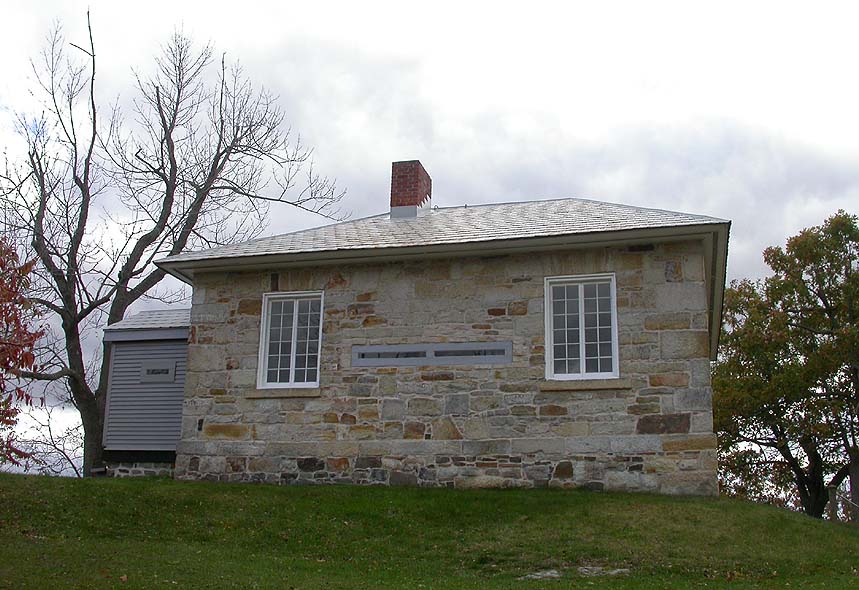 Blockhouse on hill overlooking locks and dam