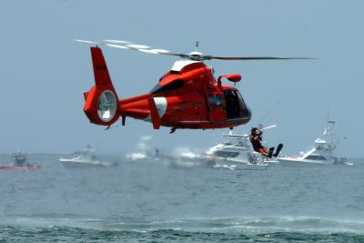 Coast Guard jumping out of chopper.jpg