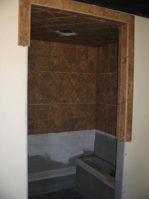 The shower tiles going up, or down.