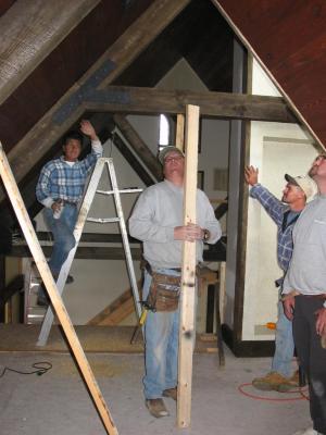 Gus painting the bolts as the roof caves in? Looks like they're worried!