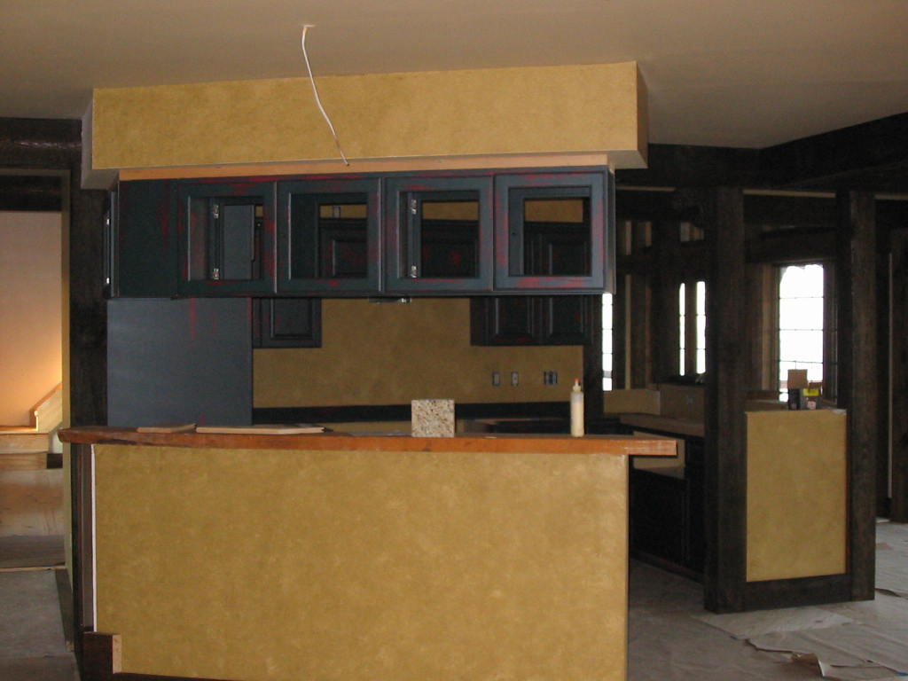 The kitchen peninsula is just WAITING for a counter top ... wonder what it will be
